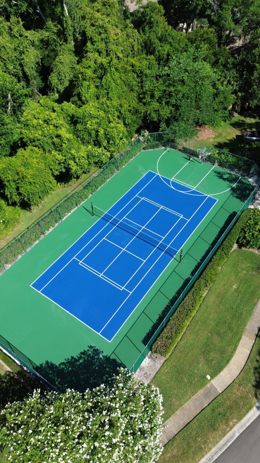 Aerial view of a custom blue and green tennis court